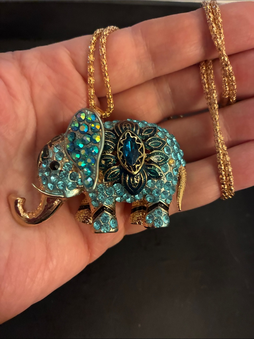 Blue Crystal Elephant Pendant Necklace with Gold Accents.